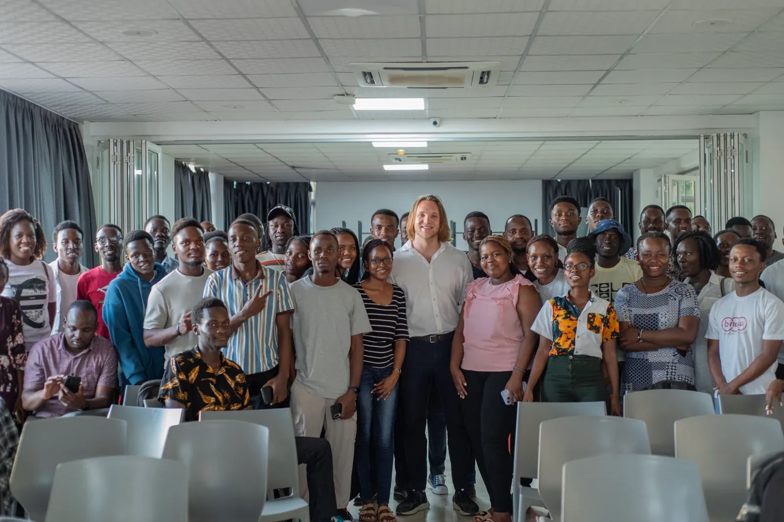 Yves with the attendees of the AI event at the Innovation Village in Uganda